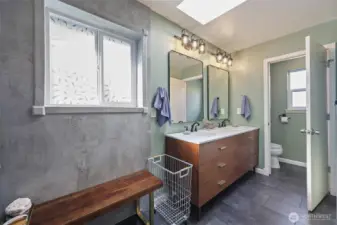 Dual vanity and separate water closet.