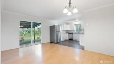 Dining room opens into large backyard