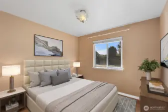 Virtually staged to illustrate scale and design potential, this inviting bedroom easily accommodates a full bed and complementary furnishings