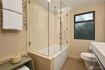 Newer bath with custom towel rack.