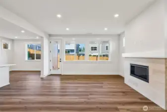 Welcoming great room warmed by a gas fireplace.