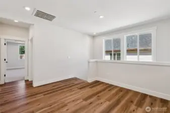 View of stairway windows flooding the loft with natural light.