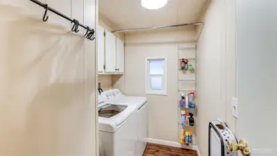 Laundry area with cabinets