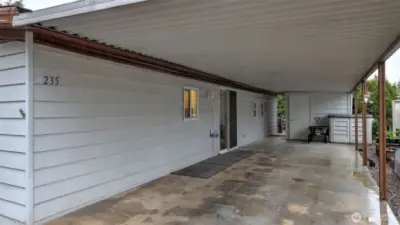 Long covered carport with storage