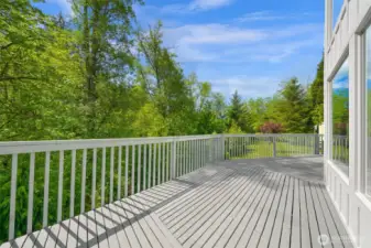 Enjoy the serenity of Dakot Creek from the expansive main floor deck.