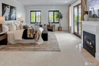 Owner's retreat with a spa-inspired bath, spacious walk-in closet and a cozy gas fireplace for added ambiance. Enjoy sunsets from the serene view deck.