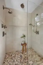 The ultimate shower retreat, featuring a luxurious triple-head system w/soothing rain shower, targeted sprayer, and a full-pressure showerhead - designed for a customized spa-like experience!