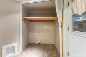 Downstairs utility room with cat door.