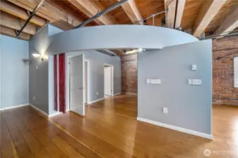 Open floorplan with a carved out bedroom, walk-in closet, 5 piece bath, and ceiling fan.