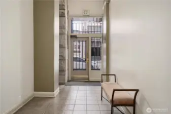 Unassuming exit door. Double locking doors and keypad or keyed entry.