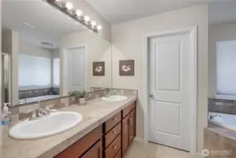 Double sinks in Primary Bath, with door to water closet.