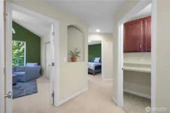 Landing upstairs looking into Bedroom #2 and Bedroom #3.  Laundry Room on right, and hallway bathroom down hall to the right. Two linen/storage closets on this level also!