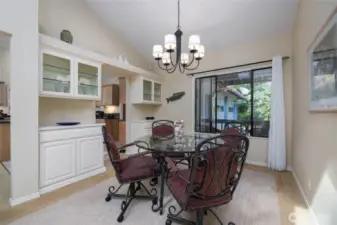 Dining room has built in cabinets for dishes and glassware.
