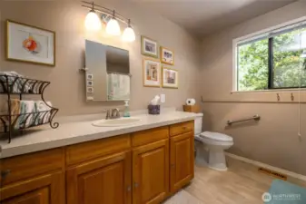 Guest bathroom with tub and shower