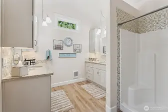 New spa bathroom, new soft close vanities with lvp flooring & electrical plug ins in the cabnetry
