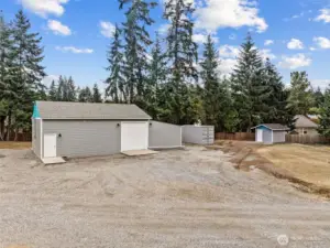 shop features 2 new concrete pads, new gravel, siding & roof to include 3 phase 400 amp panel