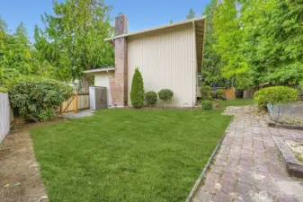 From the east side of the yard, you'll find a small work shed, brick pathways, raised gardens and a new gate.