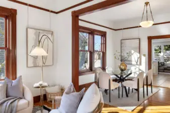 The dining room also boasts high ceilings, original millwork, Rejuvenation light fixture and Anderson windows.