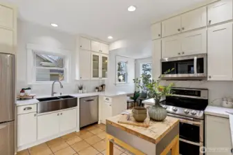 Newer stainless steel appliances including a double oven, Bosch dishwasher, LG microwave / hood and double undermount stainless steel sink.