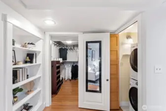 Built-in storage shelves and a laundry room complete the primary suite.