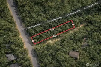 Not a survey. Overhead view with approximate boundaries in red along with approximate dimensions.