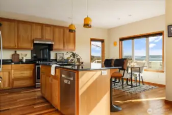 Black granite counters compliment the custom alder cabinets.