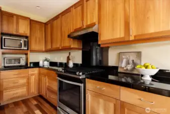 The gas stove is a chef's dream with high quality appliances throughout the space for cooking and creating.