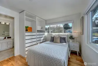 This lovely primary retreat features abundant built-in closet space.