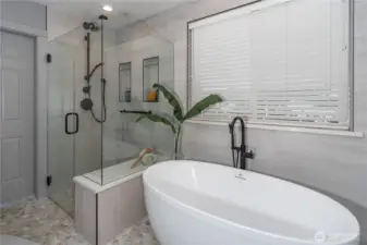 Bath is equipped with its own tankless hot water heater.