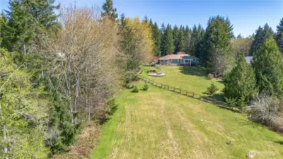 Notice the partial fenced yard for pets or people.