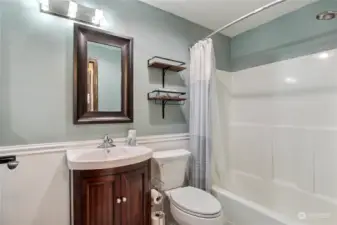 Main bathroom, updated with newer vanity, flooring and toilet.