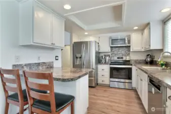 Well appointed kitchen with eating space, includes a window over the sink looking out to backyard. Would be perfect for a future pass-through window or garden window. Whichever your heart desires.