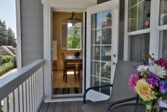 One of our Sellers most favorite features of their home. Enjoy your covered view balcony year round. Perfect spot for a morning cup of coffee or an evening glass of wine. Retractable screen door keeps the bugs out!