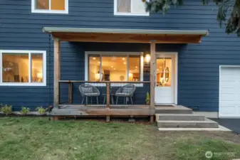 Sweet front porch is ready for you to enjoy coffee, chat with neighbors, or welcome guests.