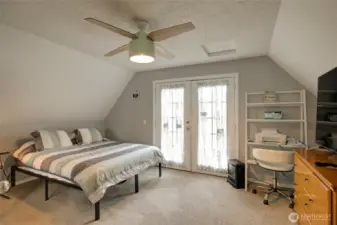 Upstairs bedroom, with balcony over looking back yard