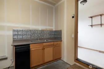 2 car garage with sink and dishwasher.