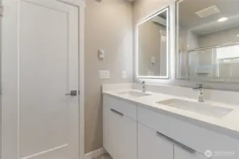 Primary ensuite has back lit mirrors
