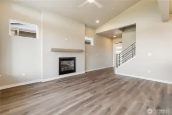 Stairs in foreground of Living area lead to upstairs.