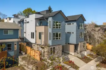 Welcome to the Capitol Pines Collection — where sleek modern design meets timeless Northwest charm. These striking homes make a statement from the curb with bold symmetry, crisp lines, and a central walkway that sets the tone for something unique.