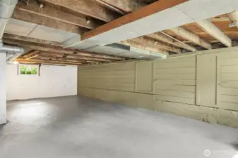 The downstairs is a blank canvas of possibility. The unfinished ceilings provide a look at the bones of the home.