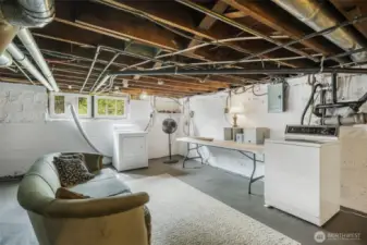 The laundry area and other systems are housed in the basement, which can be accessed from inside the house or from the outside through a side door.