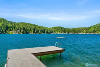 Private, low-maintenance dock built with composite decking, steel piers, and a swim step, set against open lake views.