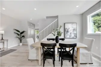 Entry, living & dining room. Previous built Peak house. Finishes may be different.