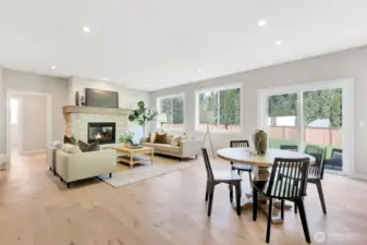 Kitchen nook to large family room with gas fireplace. Previous built Peak house. Finishes may be different.