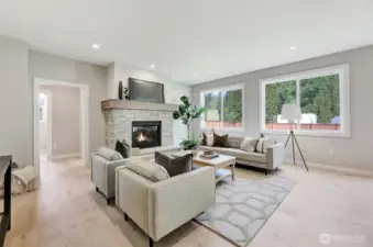 Family room with gas fireplace. Previous built Peak house. Finishes may be different.