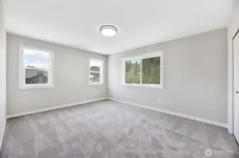 2 of 4 upstairs bedrooms. Previous built Peak house. Finishes may be different.