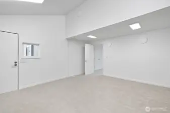This huge room can be transformed into whatever you imagine. Currently being used as a media/TV room. Comes with it's own outside entry to the left of picture.