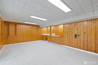Lower level also has a sink/wet bar area, room for small fridge in cabinet and a closet for additional storage.