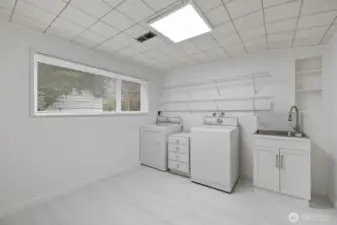 Amazing lower level laundry room. Brand new tile floor. Washer/Dryer stay.