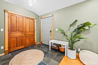 Front Entrance features slate tile and showcases solid millwork.